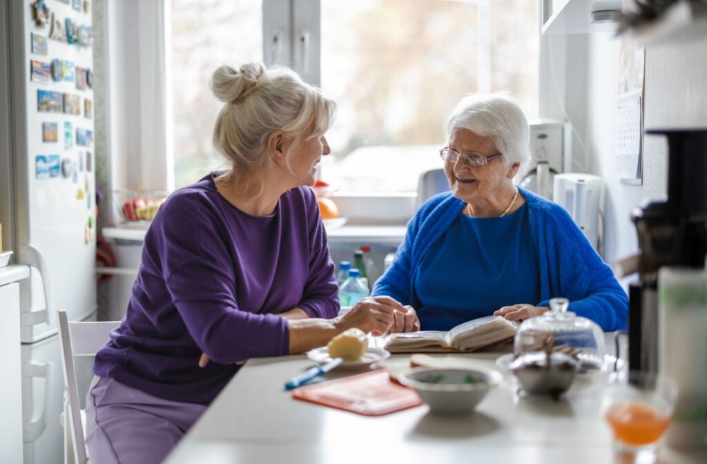 A woman spending quality time with her elderly loved one in memory care.
